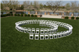 White Outdoor Chairs Set up in a Spiral